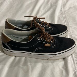 Vans women’s size 9.5 mens size 8 black sneakers.